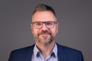 Photo of a man in a suit.